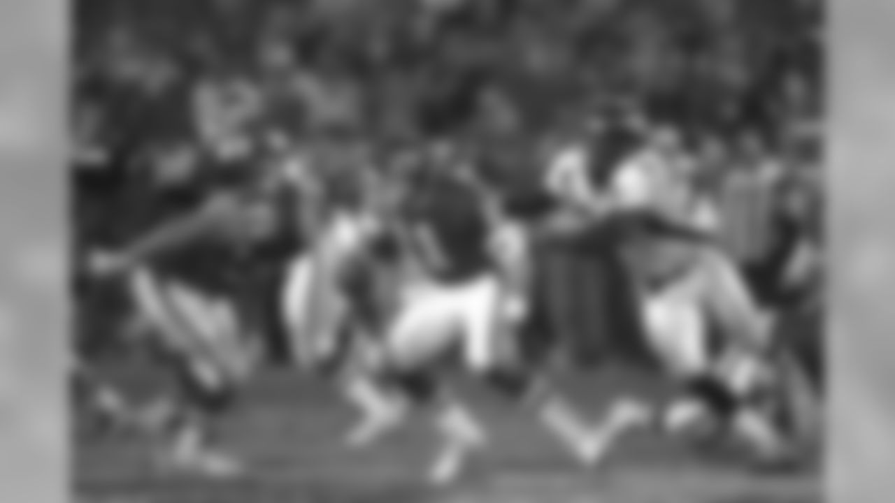 Defensive end Alfred Williams and the rest of the Broncos defense rose to the occasion and wreaked havoc on Chiefs quarterback Elvis Grbac by registering four sacks on the afternoon against the Kansas City Chiefs at Arrowhead Stadium in Kansas City on January 4, 1998.