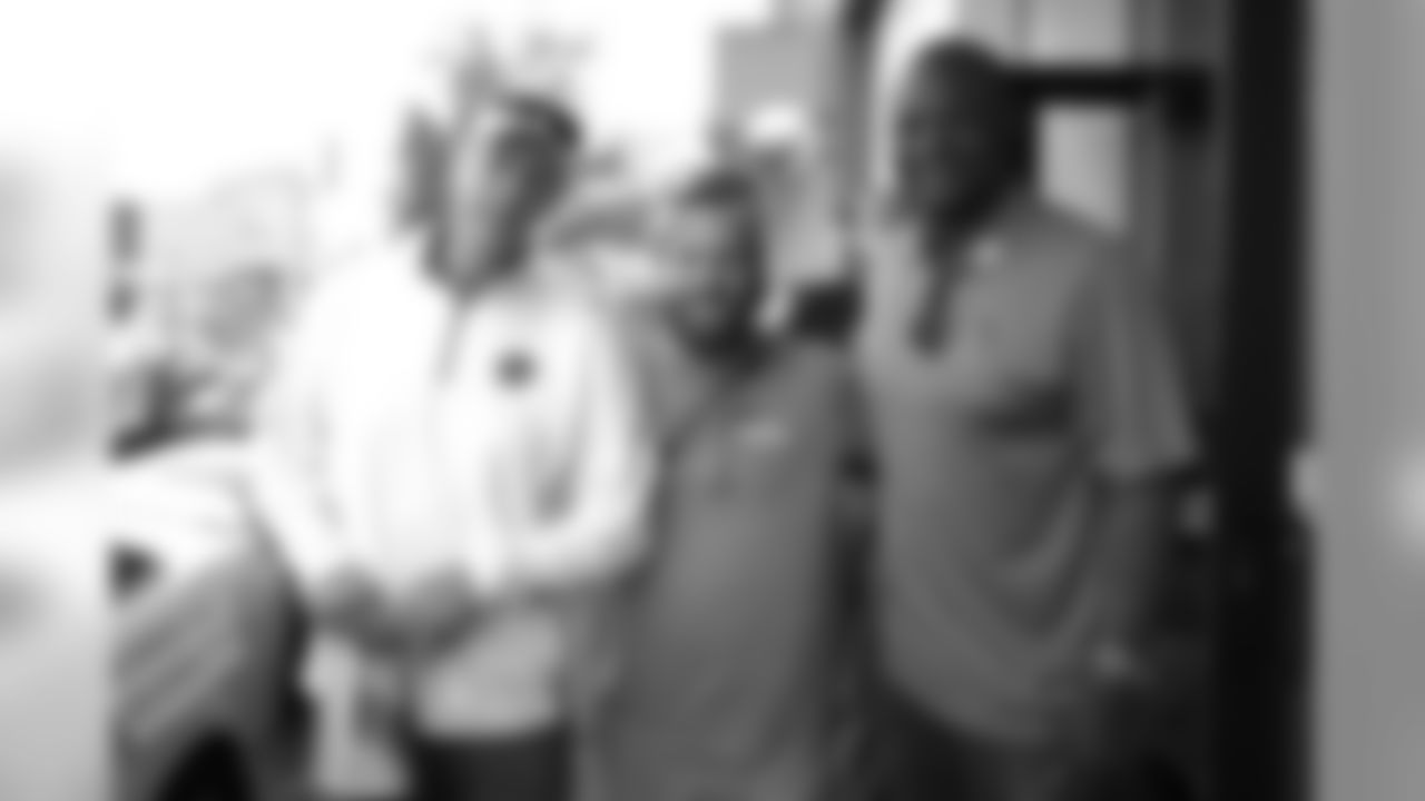 Patrick Bowlen Jr. with Jim Kelly and Warren Moon during the Canton Repository Grand Parade on August 3, 2019 in downtown Canton, Ohio.
