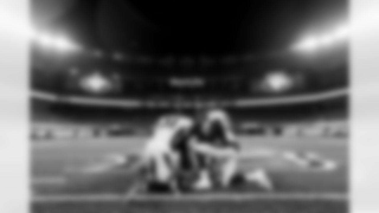Justin Simmons, Malik Reed and Joe Jones pray on the field after the 37-28 win in the Broncos' Week 4 game against the New York Jets at MetLife Stadium in East Rutherford, New Jersey on October 1, 2020. (Photo by Ben Swanson)