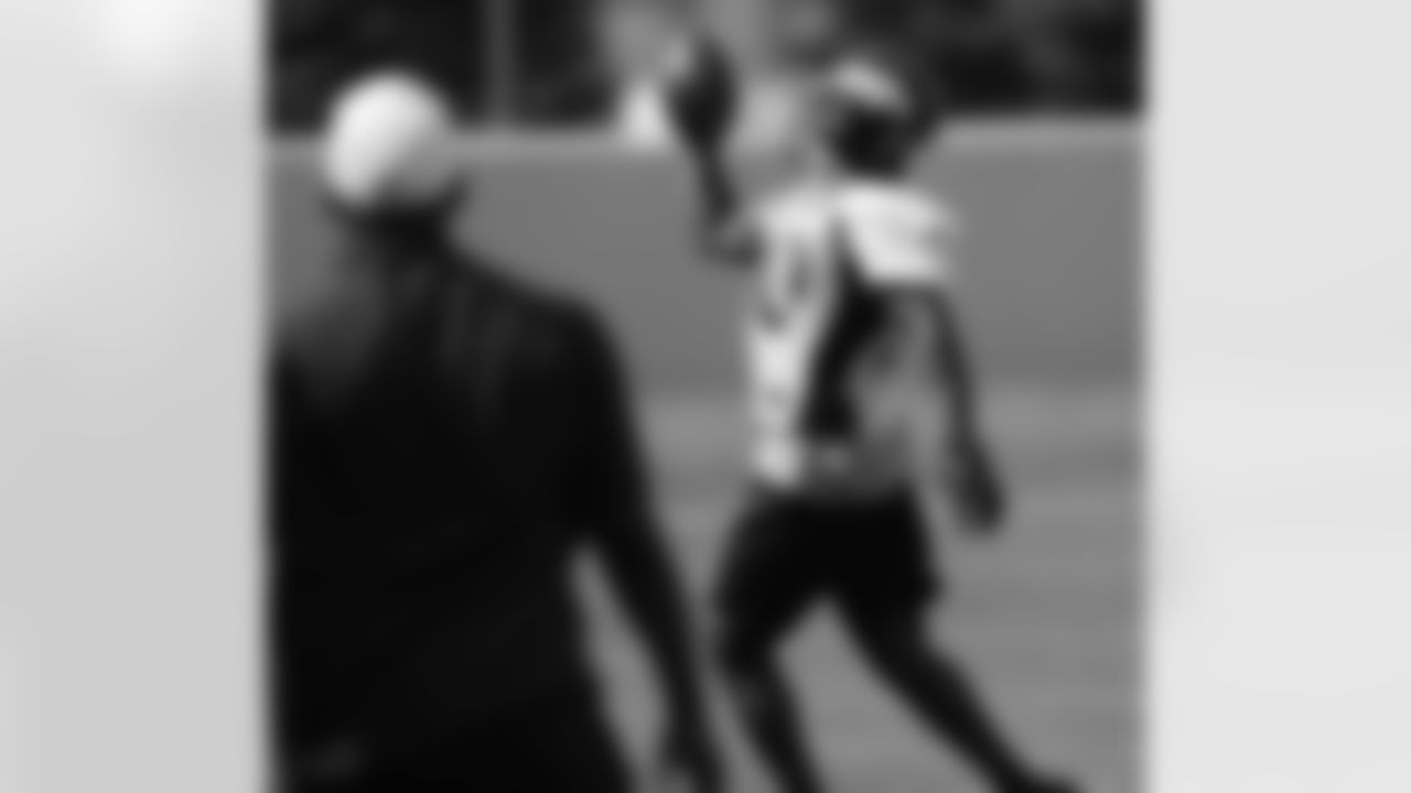 Adams grabs the ball with one hand.