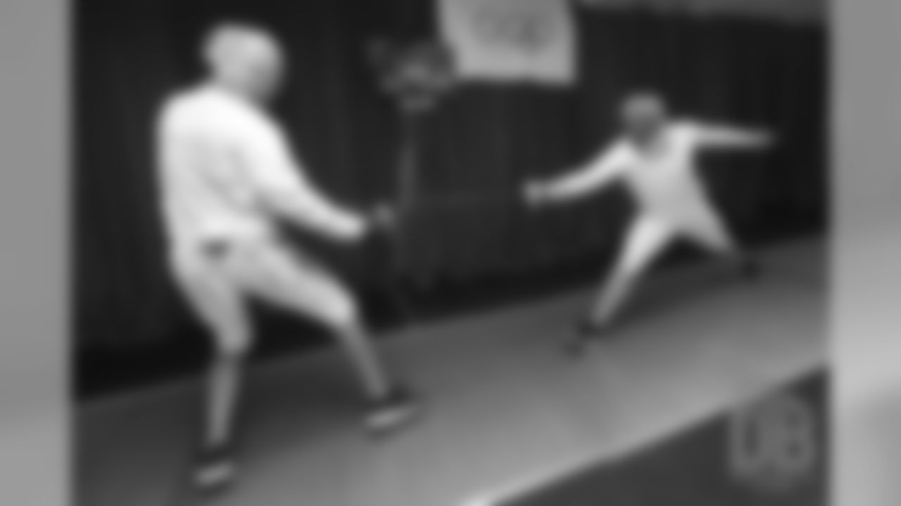 Brandon McManus and Casey Kreiter try their hands at fencing at the Denver Fencing Center on July 17, 2018.