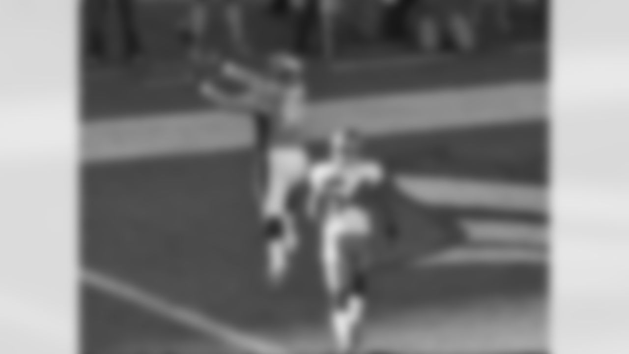 Manning's pass drops into Unrein's waiting hands in the corner of the end zone.