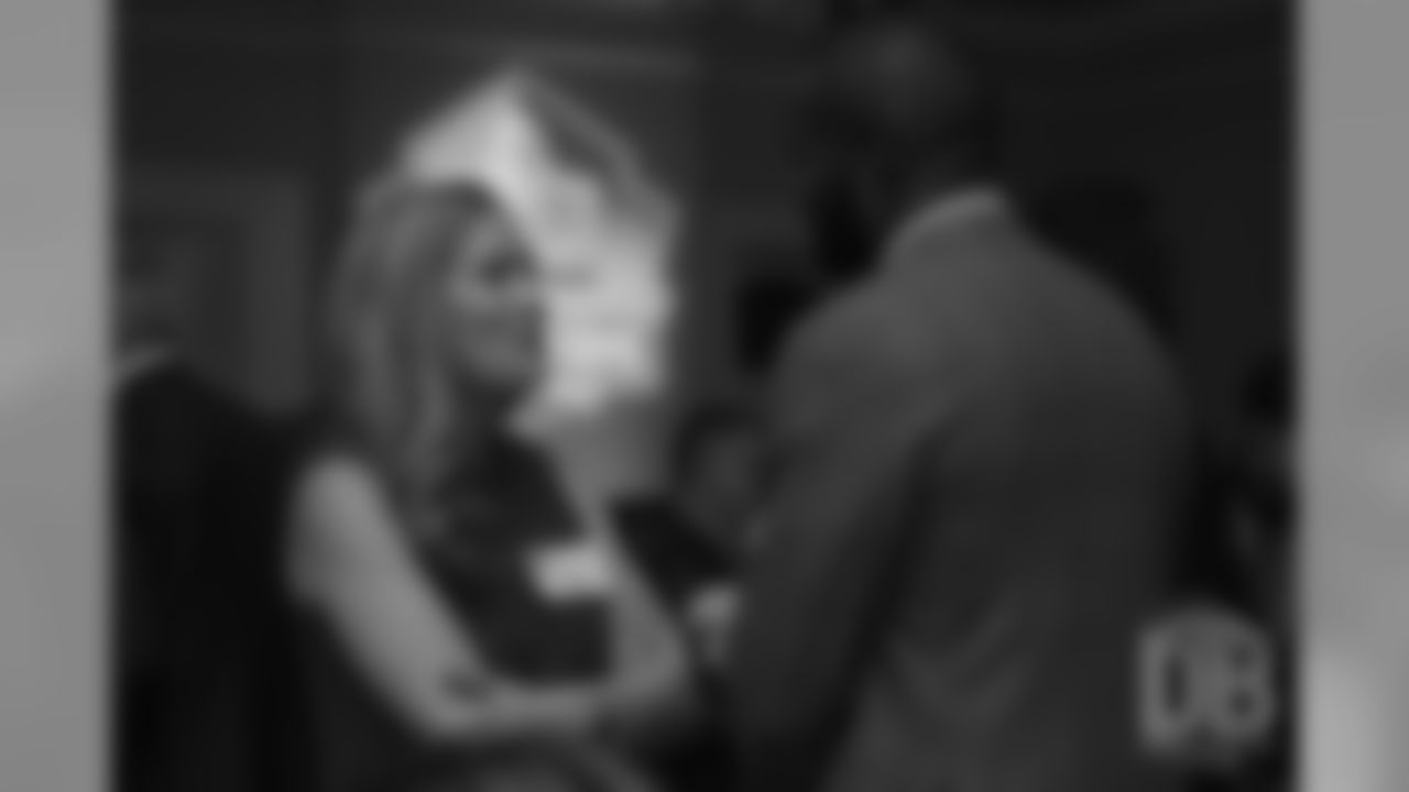 Brittany Bowlen talks with Champ Bailey at the Pro Football Hall of Fame's Celebration of Excellence Reception in Atlanta on January 31, 2019.