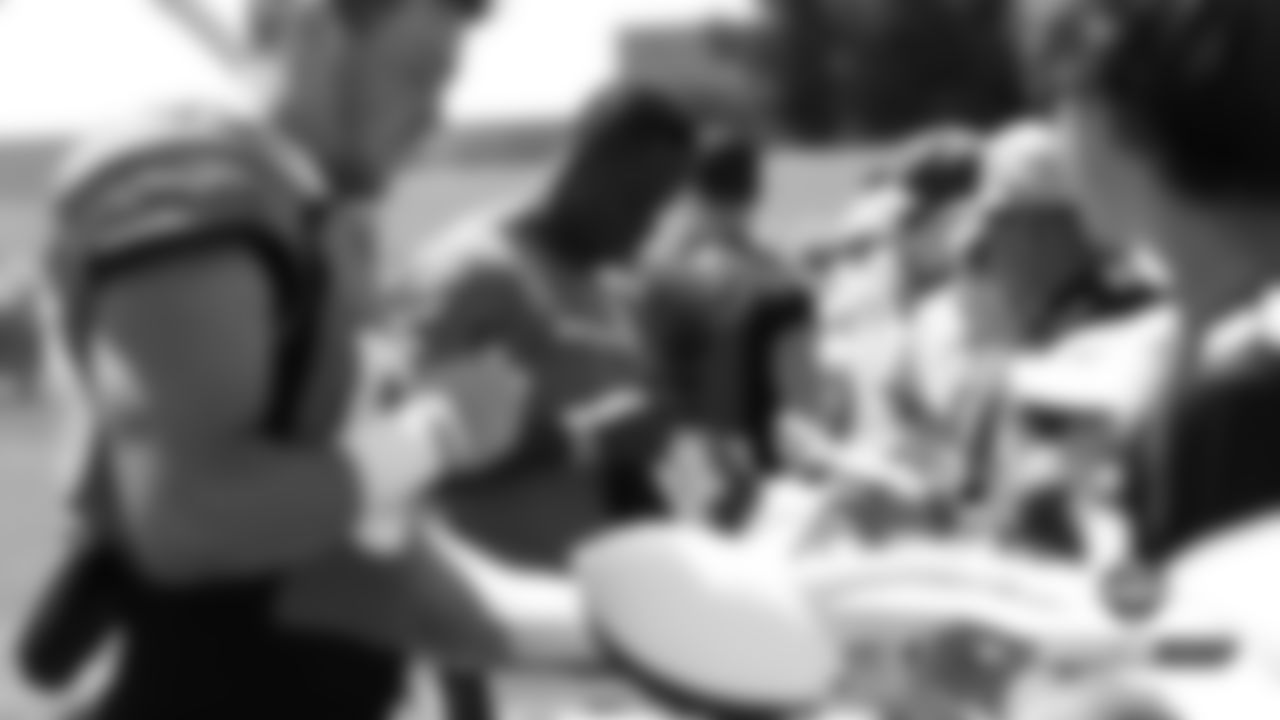 Joe Jones signs autographs after practice on Day 8 of training camp on July 26, 2019.