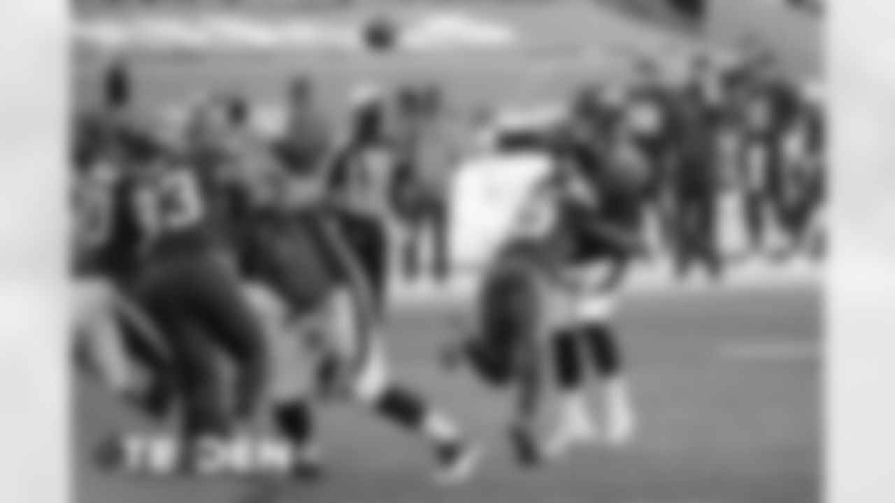 Brett Rypien is hit as he throws during the second half of the Broncos' Week 3 game against the Tampa Bay Buccaneers at Empower Field at Mile High on September 27, 2020. (Photo by Ben Swanson)