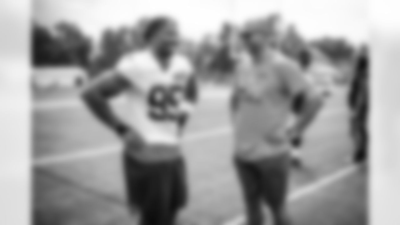 Joe Thomas meets with Defensive end Myles Garrett (95) during the fifth day of training camp at CrossCountry Mortgage Campus on August 1, 2022.