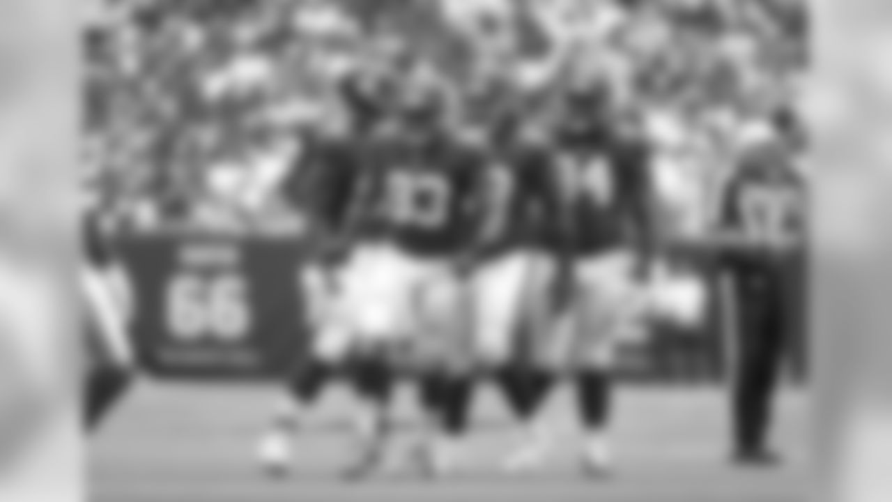New York Giants linebacker B.J. Goodson (93) celebrates a sack along with defensive linemen Damon Harrison Sr. (98), defensive lineman B.J. Hill (95) and defensive lineman Dalvin Tomlinson (94) during an NFL football game against the Houston Texans on Sunday, Sept. 23, 2018 in Houston. (Greg Trott via AP)