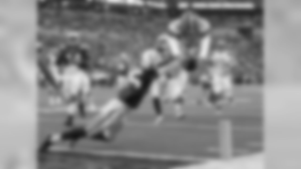 RB Duke Johnson Jr. leaps over Colts CB Pierre Desir for a touchdown.