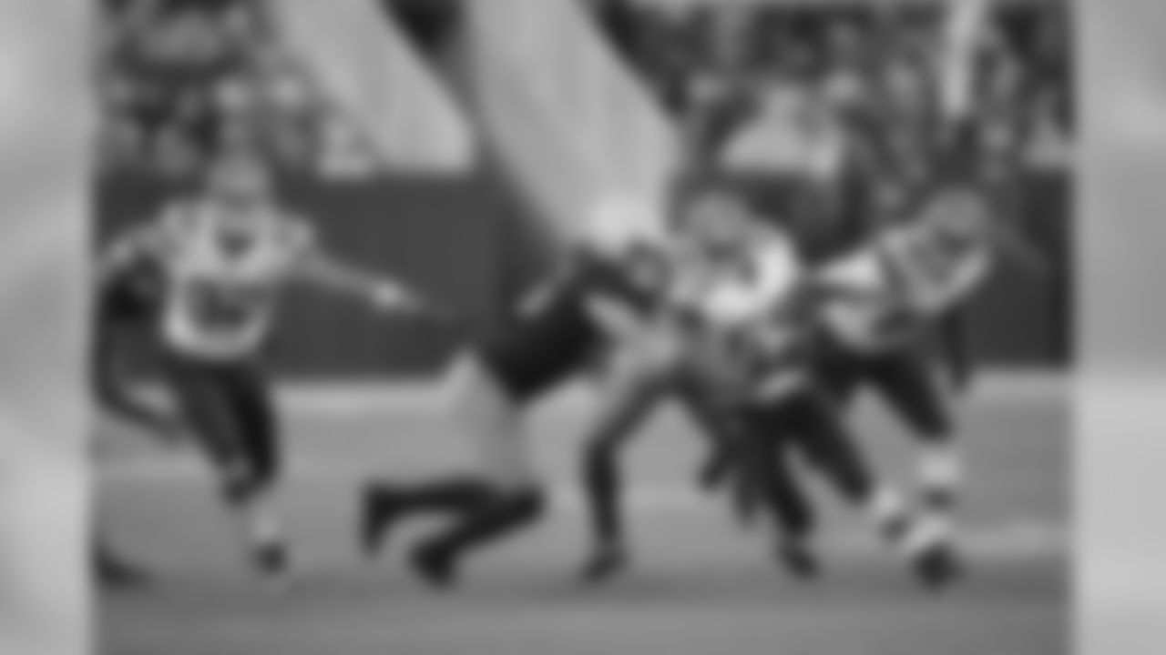 Tank Carder rushes downfield to make a special teams tackle at Green Bay on Oct. 20.