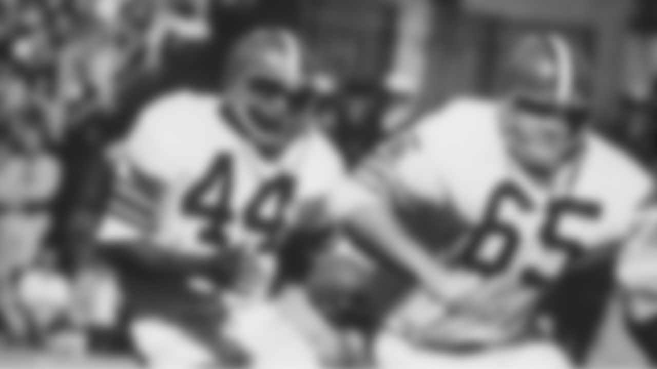 The Browns began tinkering with the spacing of their sleeve stripes in 1968, first with the brown jersey. In 1969, they added thin white stripes between the brown and orange stripes, a look that lasted until 1984. Here, Leroy Kelly runs with the ball during a game.