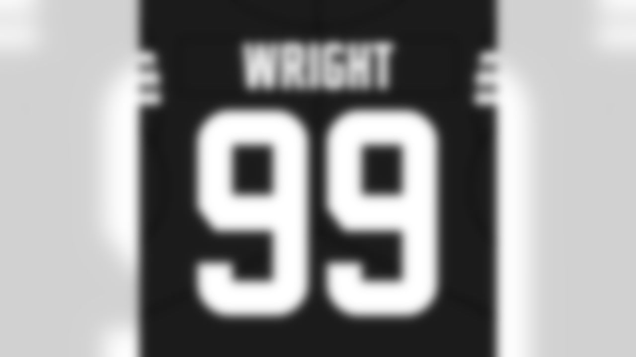 Defensive end Alex Wright (99)