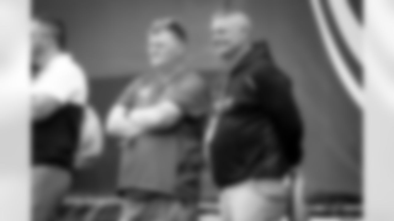 High school football coaches watch practice during the third day of OTAs at CrossCountry Mortgage Campus on May 26, 2022.