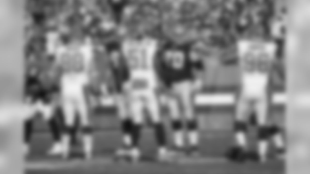 DL Jamie Meder (left), LB Jamie Collins Sr. (middle), and DL Xavier Cooper (right) on the field.