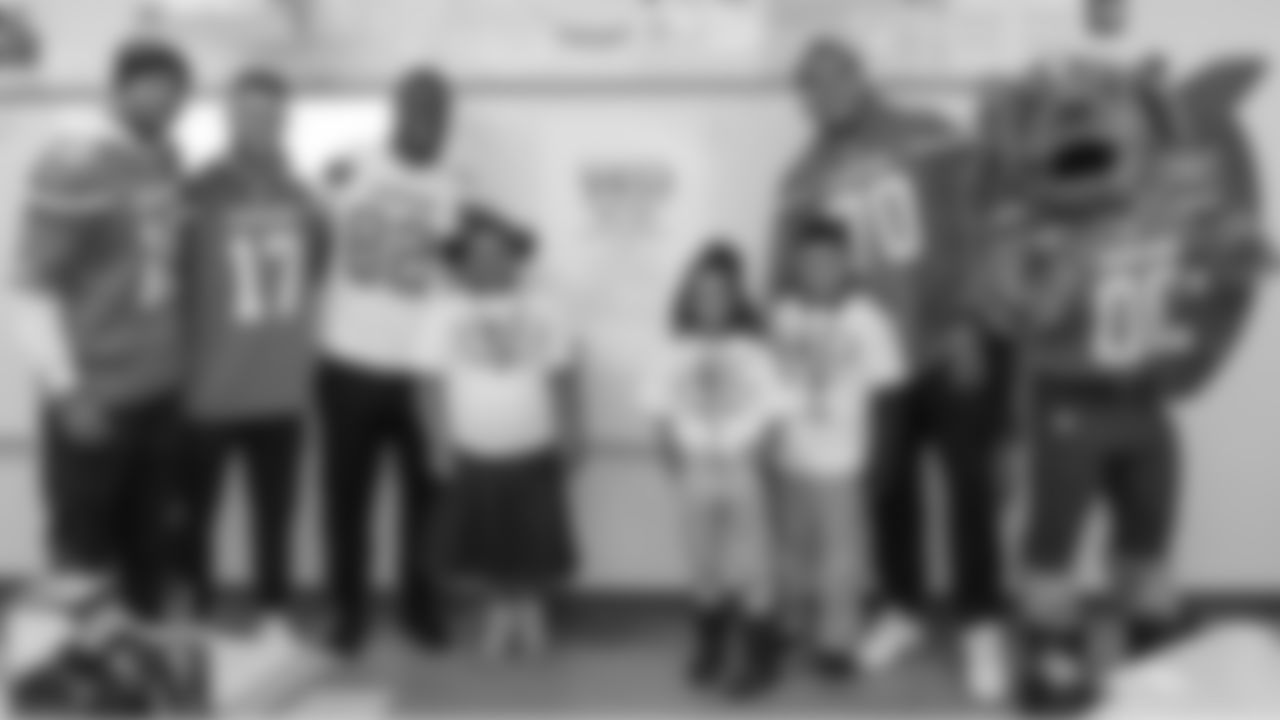 Browns players stress the importance of education and good attendance to students at Paul L. Dunbar Elementary on Tuesday in Cleveland.