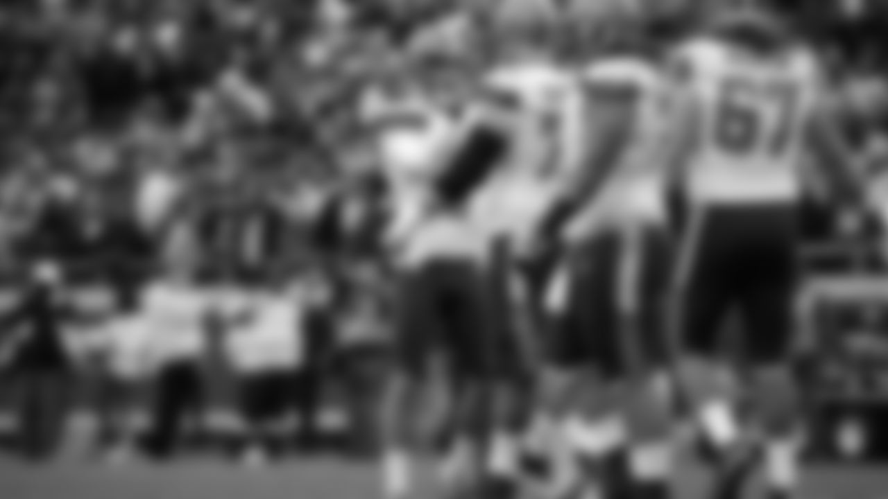 Cleveland Browns kicker Travis Coons, left, is congratulated by teammates after he scored a field goal