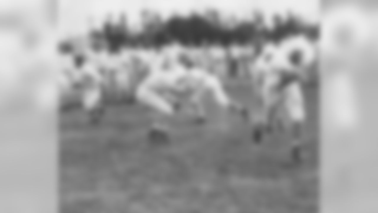 The Browns practice a blocking drill during the season.