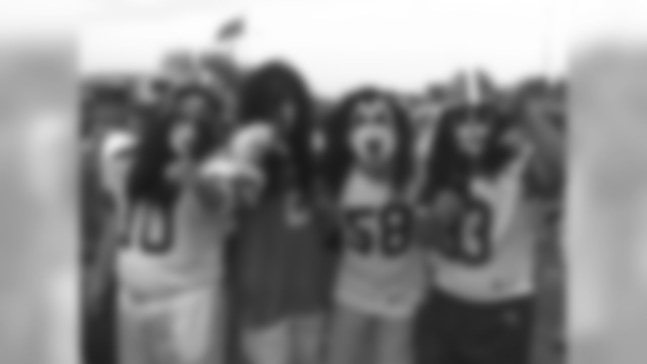 Cleveland Browns fans dressed as the rock band, Kiss, party near the stadium before the Browns season opener with the Pittsburgh Steelers Sunday, Sept. 12, 1999. (AP Photo/Tony Dejak)