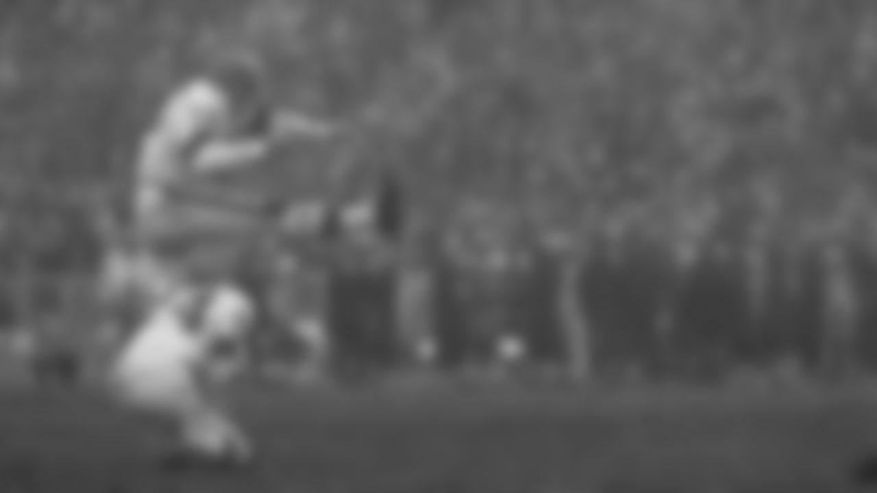 Lou Groza (76) attempts a kick during a game.