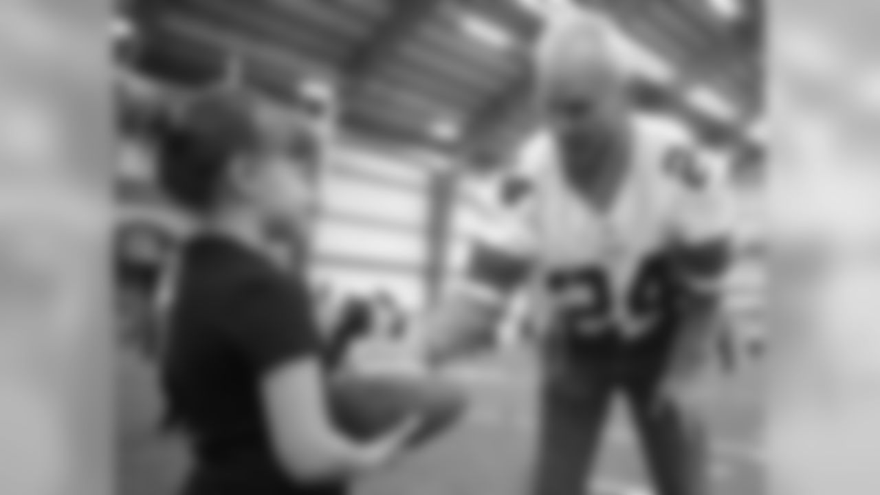 Cleveland Browns Alumni Ernie Kellermann (1966-1971)shares his football knowledge with a Special Olympics participant