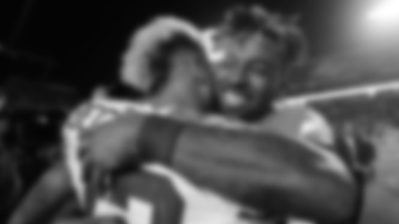 Miami Dolphins wide receiver Jarvis Landry (14) and New York Giants wide receiver Odell Beckham (13) hugs at the end an NFL football game, Monday, Dec. 14, 2015, in Miami Gardens, Fla. The Giants defeated the Dolphins 31-24. (AP Photo/Lynne Sladky)