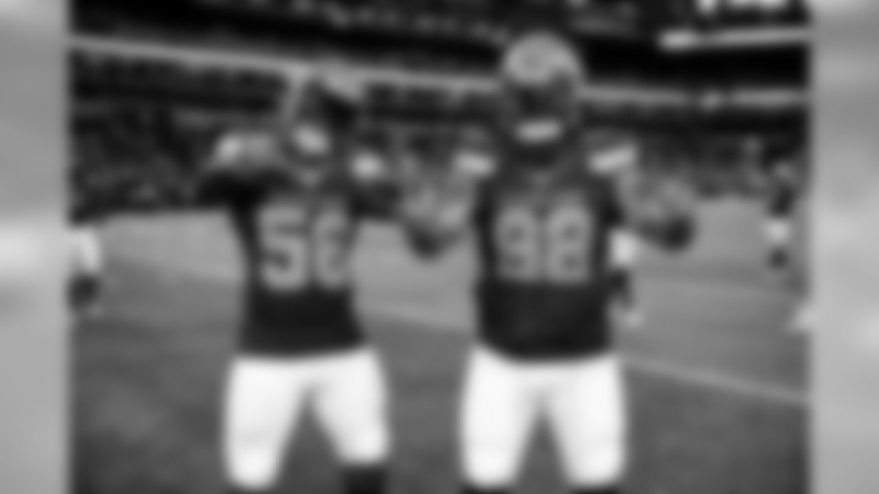 Linebacker Christian Kirksey (58) and defensive tackle Sheldon Richardson (98) warm up before the Browns vs. Colts preseason game.