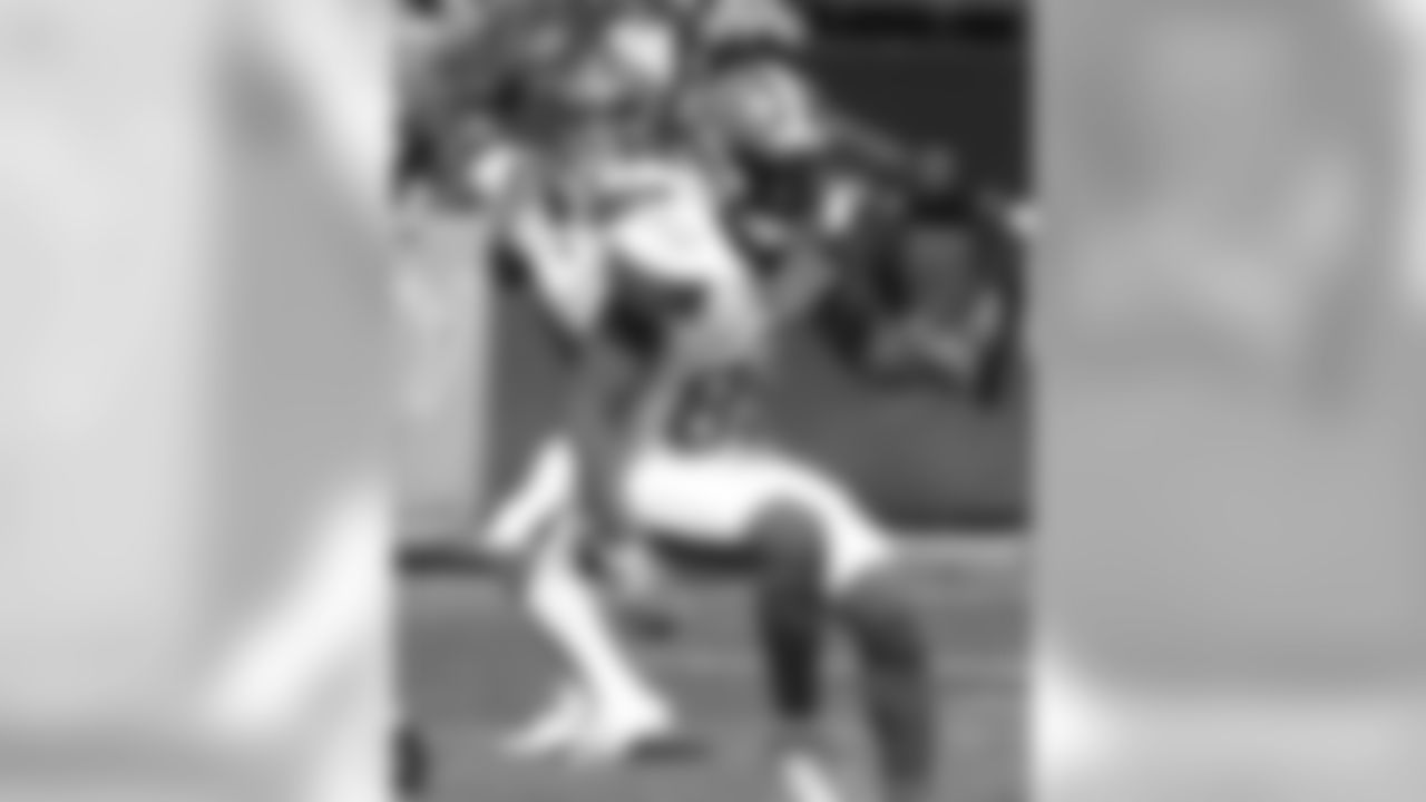 Cleveland Browns quarterback Baker Mayfield, left, passes against the Oakland Raiders during the first half of an NFL football game in Oakland, Calif., Sunday, Sept. 30, 2018. (AP Photo/D. Ross Cameron)