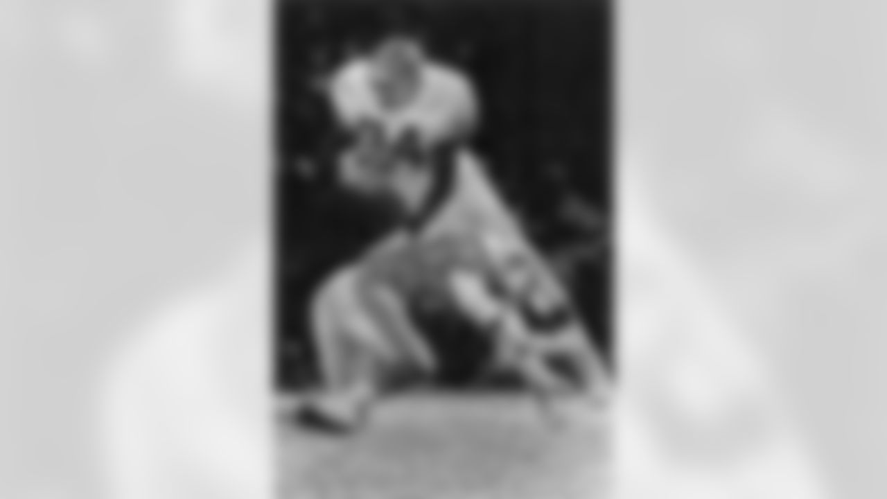 Mack hurdles over a Houston Oilers defender