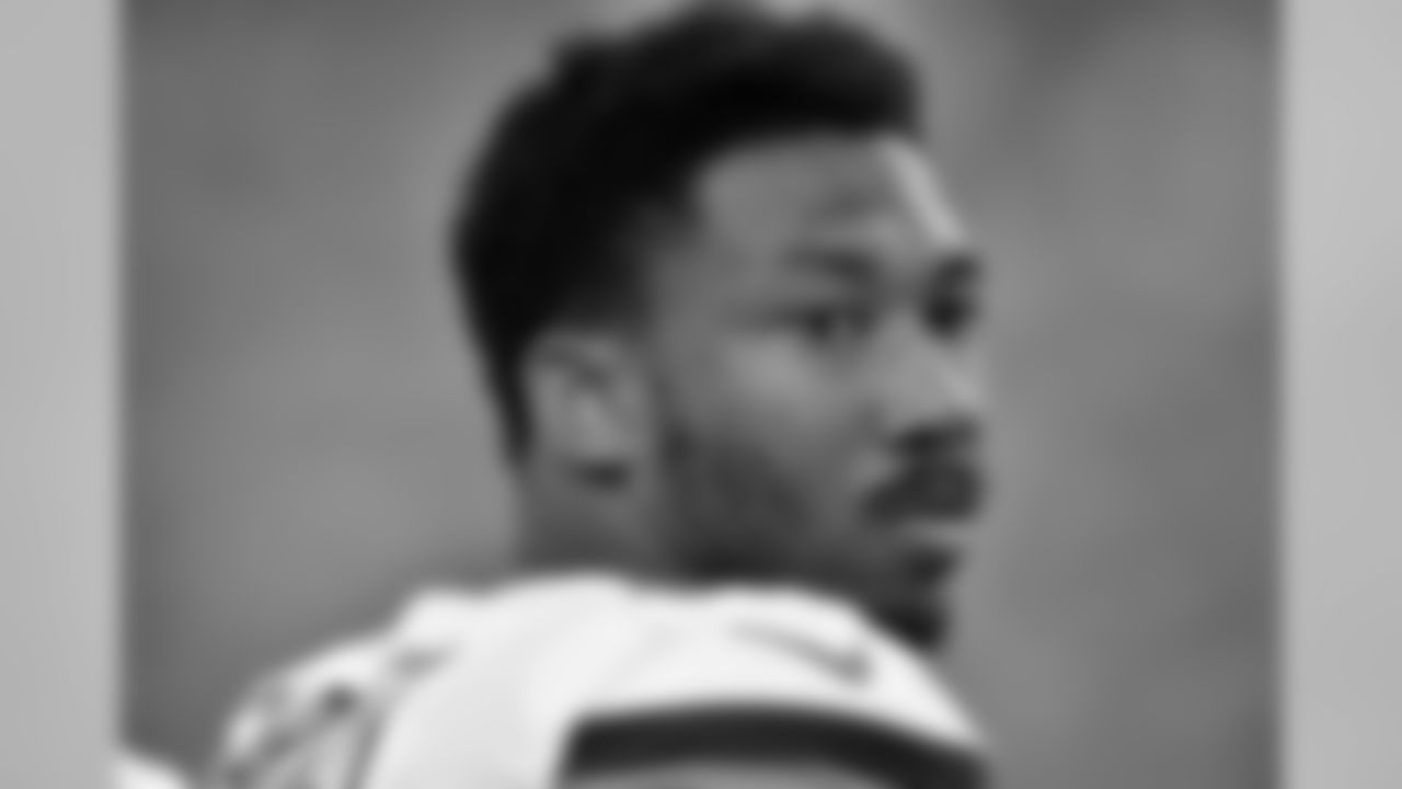 DL Myles Garrett watches from the sideline.