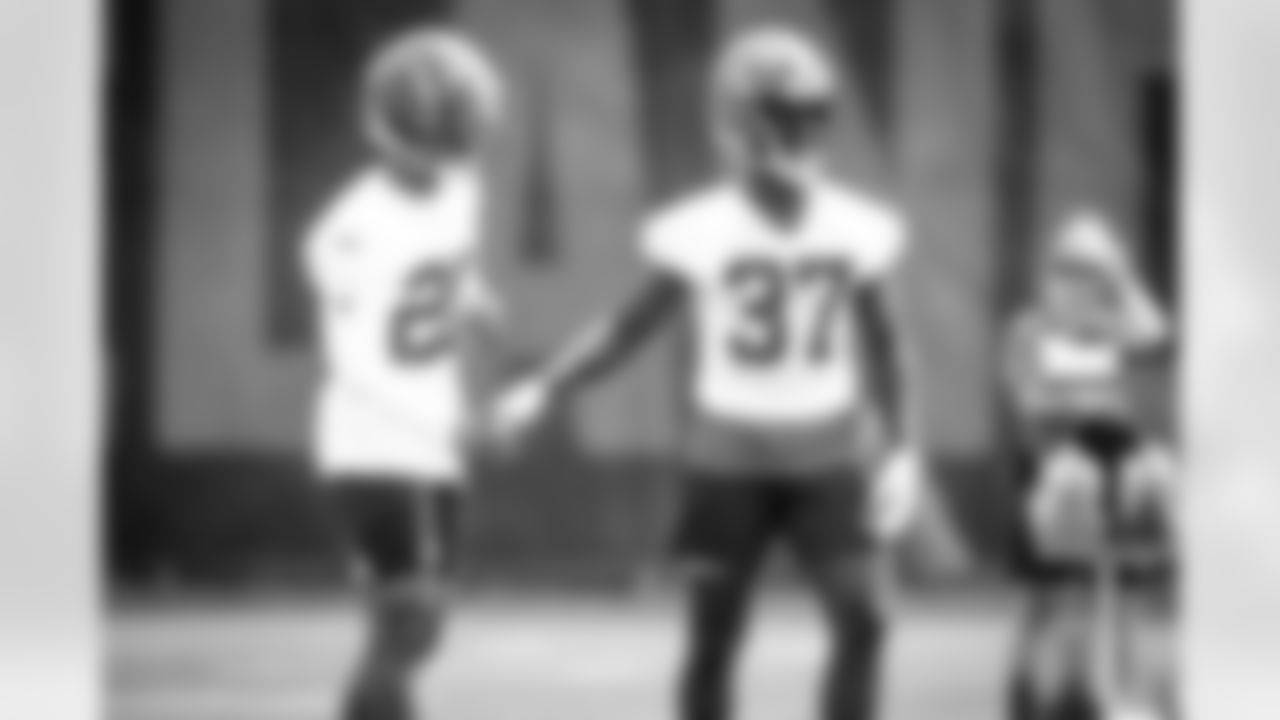 Cornerback Greg Newsome II (20) and Cornerback Emmanuel Rugamba (37) during the second day of rookie minicamp on May 15, 2021.