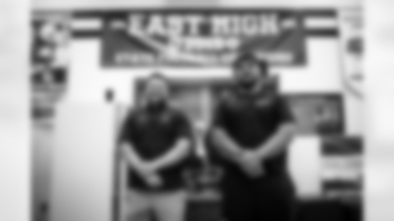 Siaki's high school head coach Brandon Matich and Defensive tackle Siaki Ika during a visit to East High School in Salt Lake City, Utah on May 9, 2023.