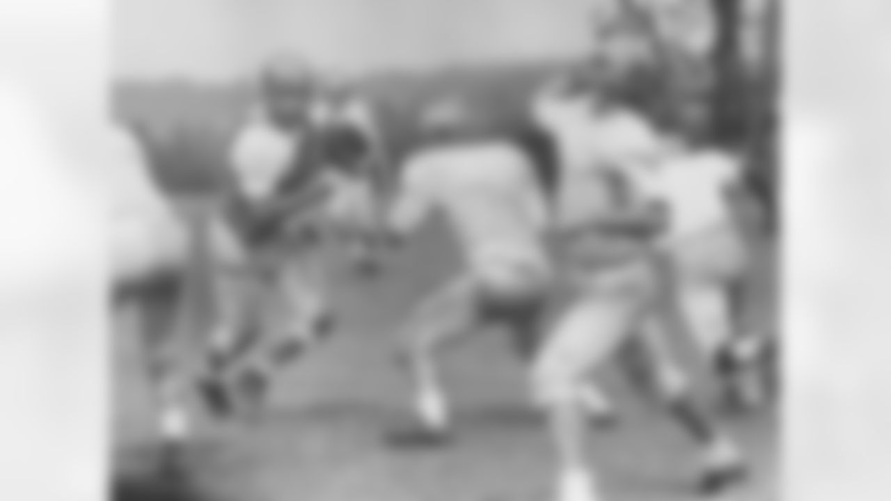 (Left to right) Bob Gain, Gene Hickerson, and Milt Plum during a practice in 1960.