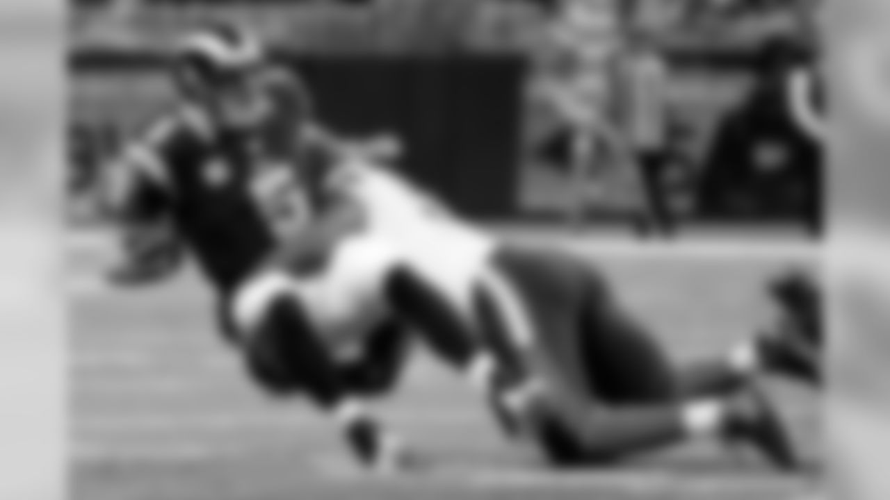 St. Louis Rams quarterback Nick Foles (5) is sacked for a 9-yard loss by Cleveland Browns defensive tackle Randy Starks