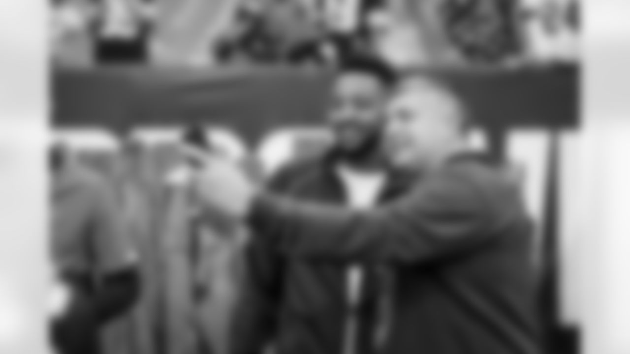 CJ McCollum with a fan before a NFL football game between the Cincinnati Bengals and Cleveland Browns on September 10, 2023 at Cleveland Browns Stadium.