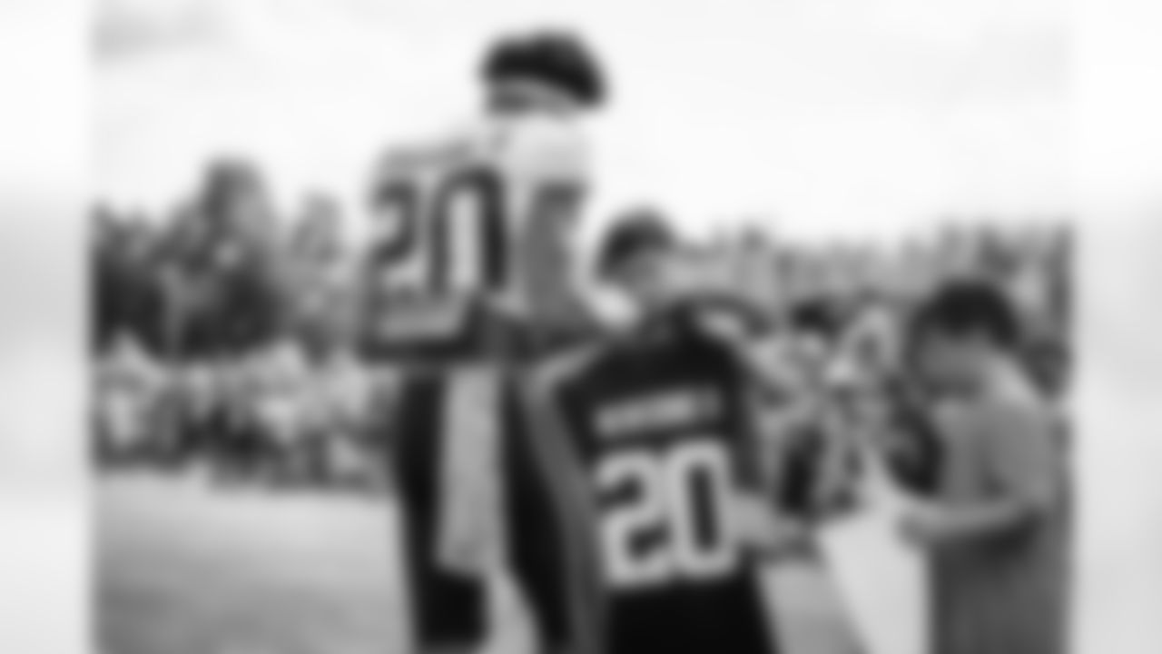 Cornerback Greg Newsome II (20) signs autograph for a fan during the ninth day of training camp at CrossCountry Mortgage Campus on August 6, 2022.