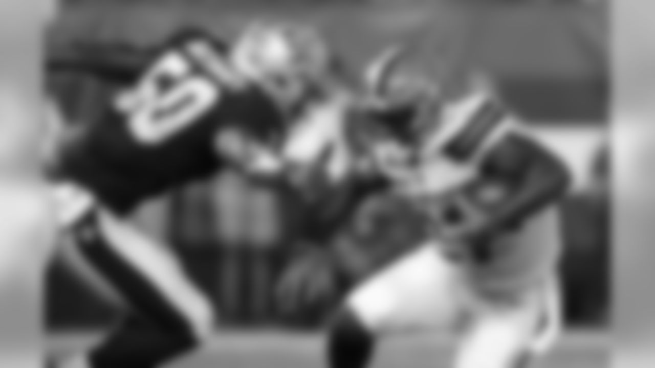 RB Matthew Dayes runs the ball against New Orleans Saints LB Stephone Anthony.