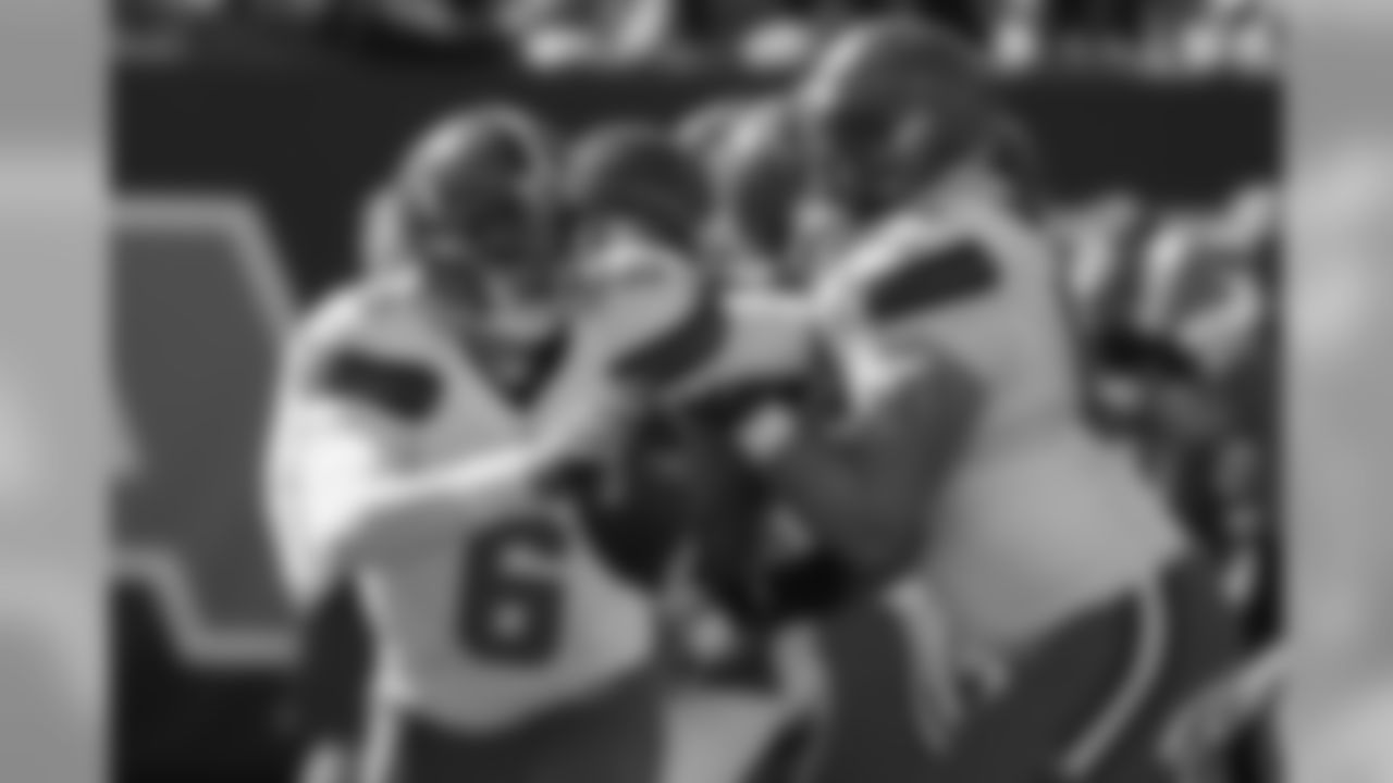 QB Cody Kessler looks to pass under pressure.