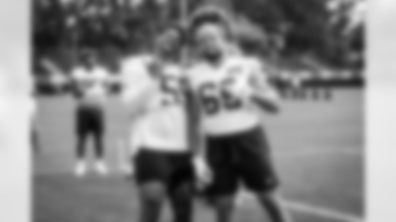 Defensive end Curtis Weaver (59) and Defensive end Chase Winovich (69) during the third day of training camp at CrossCountry Mortgage Campus on July 29, 2022.