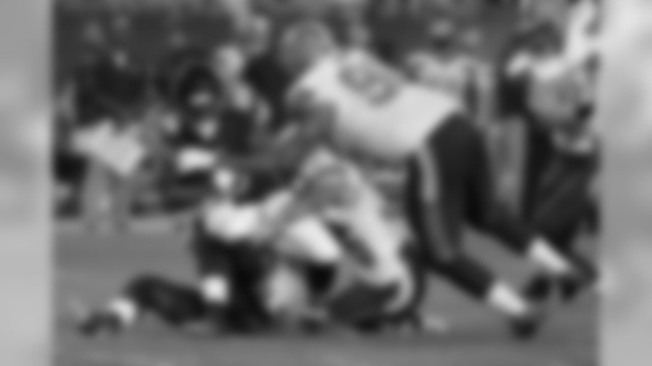 Chicago Bears running back Jeremy Langford (36) is tackled by Cleveland Browns strong safety Ibraheim Campbell, defensive back Joe Rankin and defensive end Billy Winn (90)