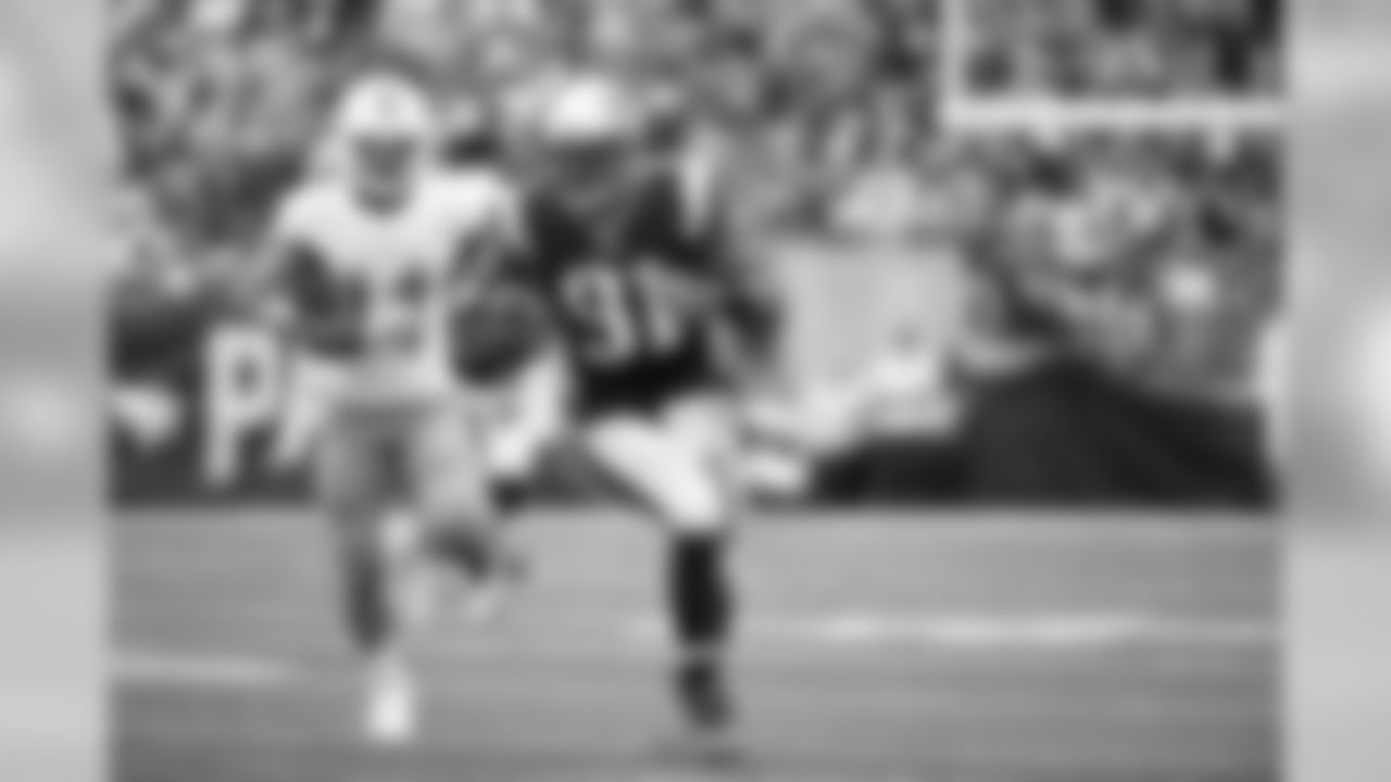 LB Jamie Collins (91) runs after making an interception in a game between the New England Patriots and the Miami Dolphins on Sept. 18, 2016.