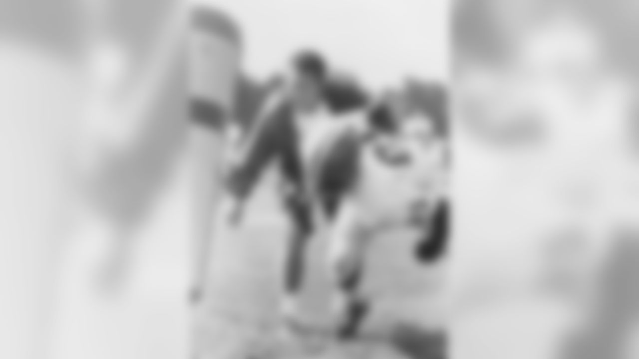Coach Bob Nussbaumer works the sleds with Homer Jones in 1970.