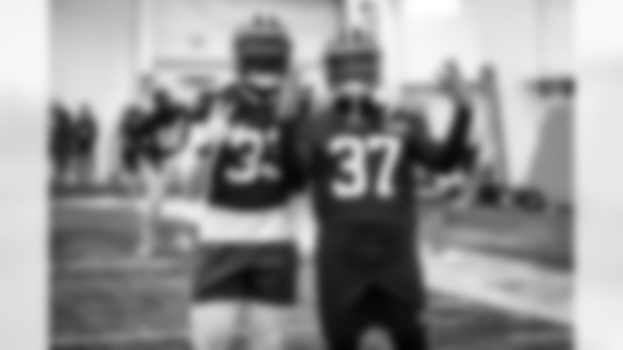 Safety Ronnie Harrison (33) and Safety D'Anthony Bell (37) during practice at CrossCountry Mortgage Campus on January 4, 2023.