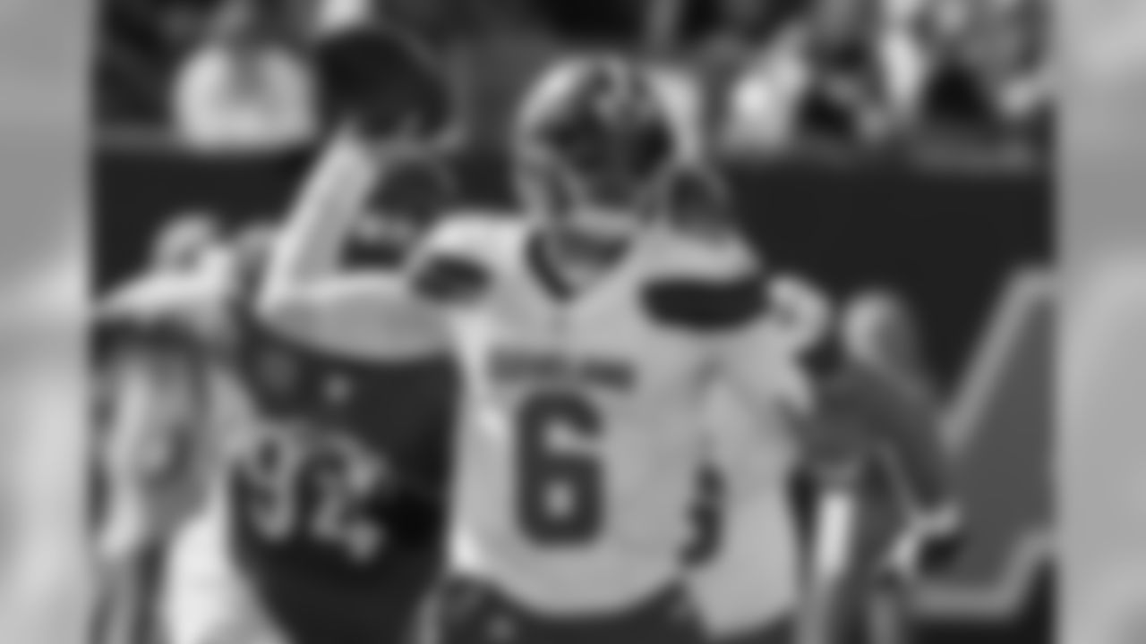 QB Cody Kessler looks to pass under pressure.