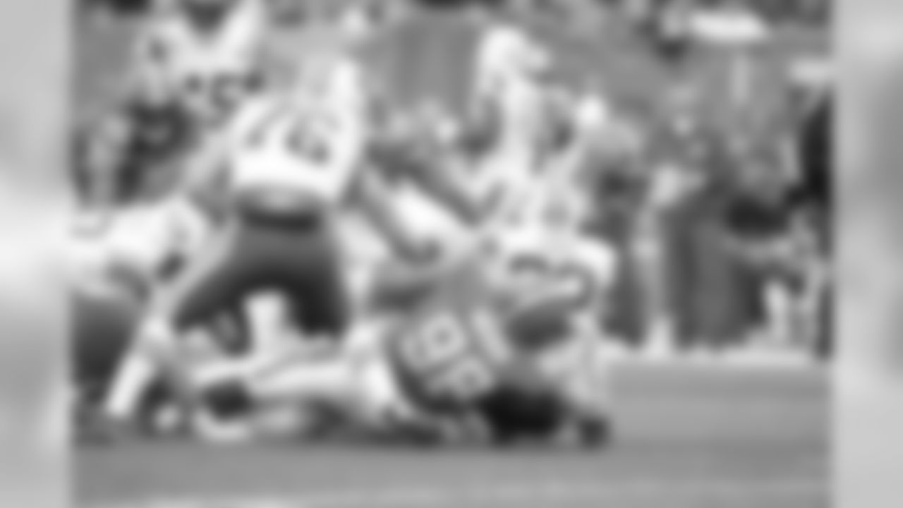 DL Jamie Meder tackles New York Jets RB Matt Forté.