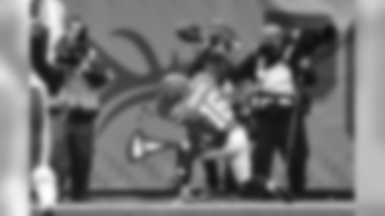 WR Andrew Hawkins spikes the ball in celebration of his touchdown.