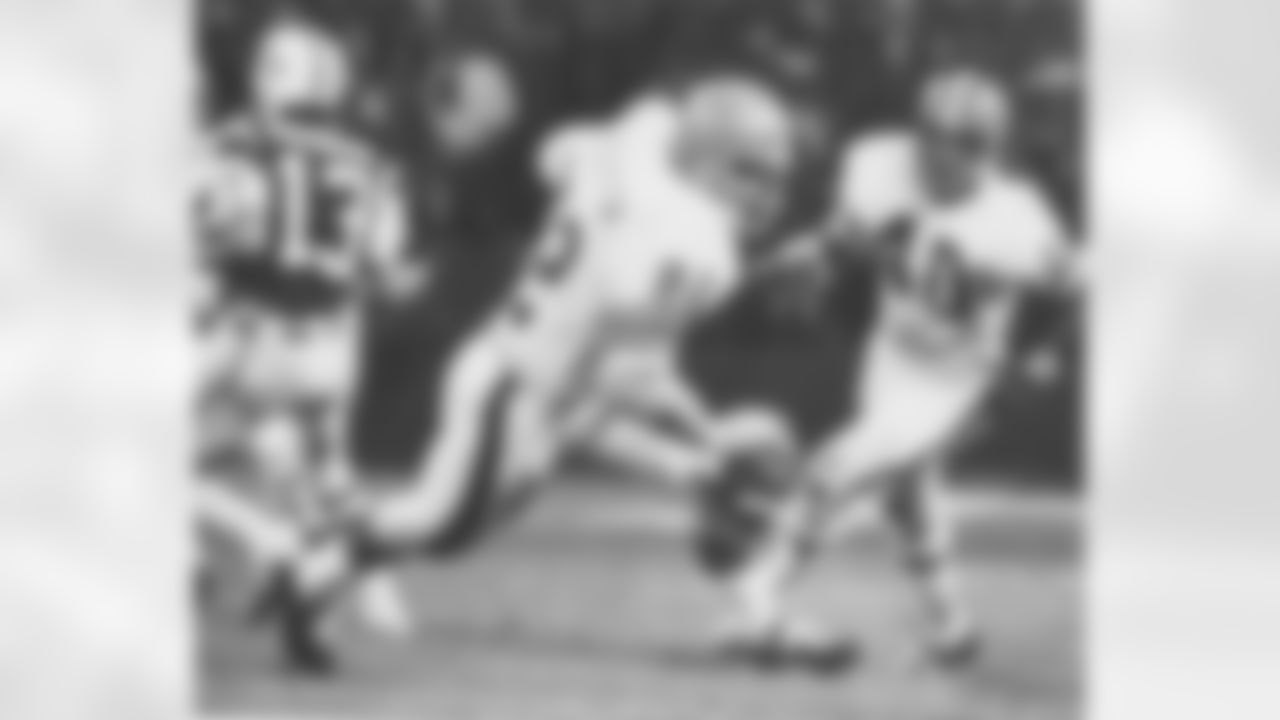 Jim Houston hauls in one of Joe Namath's three interception while Erich Barnes looks on.