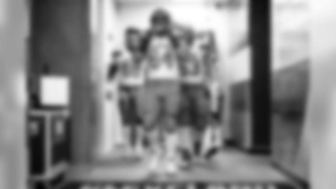 Center JC Tretter (64) and the offensive line exit the locker room before the Redskins vs. Browns preseason game.