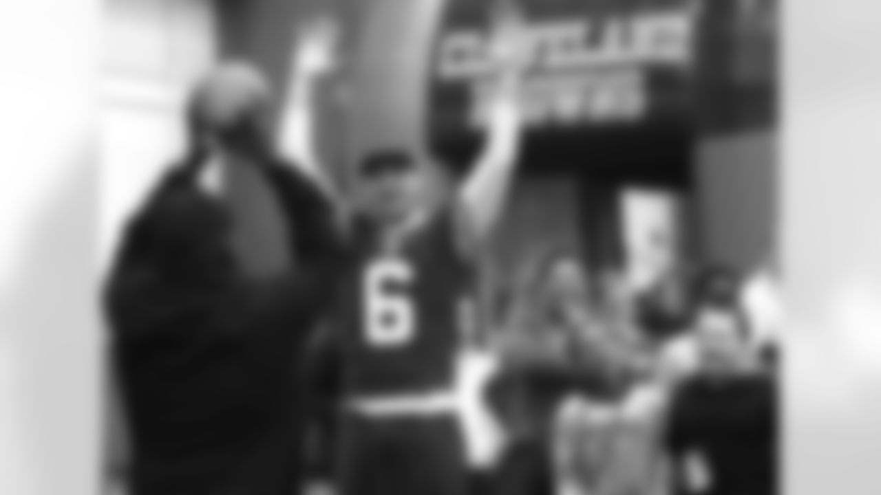 Cleveland Browns QB Brian Hoyer and a Special Olympics participant celebrate after a successfully caught pass