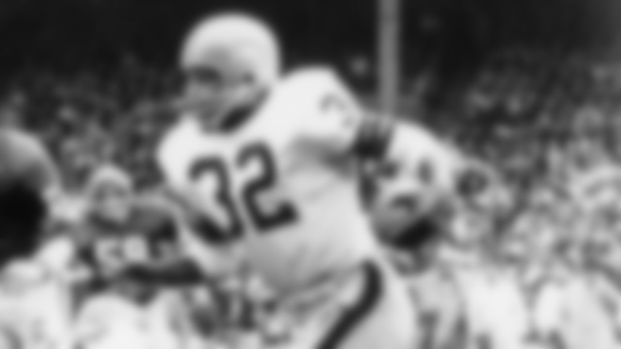 The Browns added two brown stripes on each side of the white center stripe in 1960, and ditched the helmet numbers in 1961.