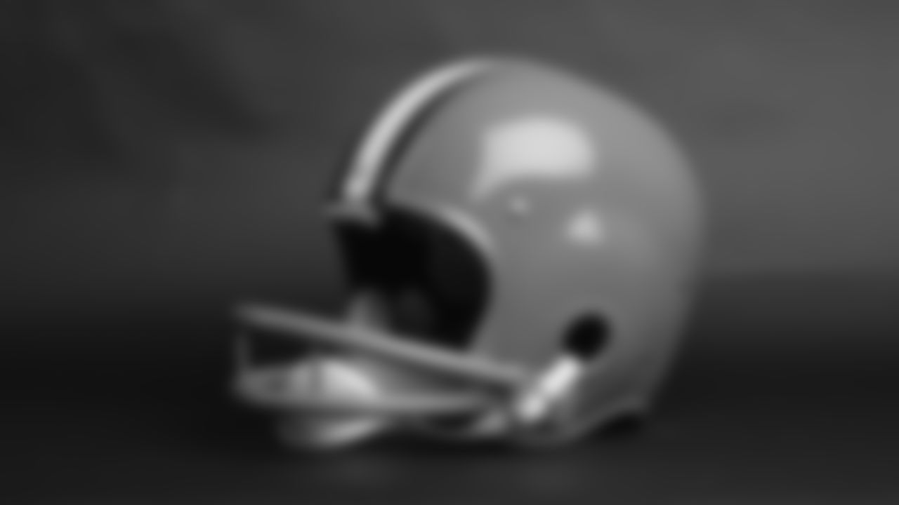 The Browns added two brown stripes on each side of the white center stripe in 1960, and ditched the helmet numbers in 1961.