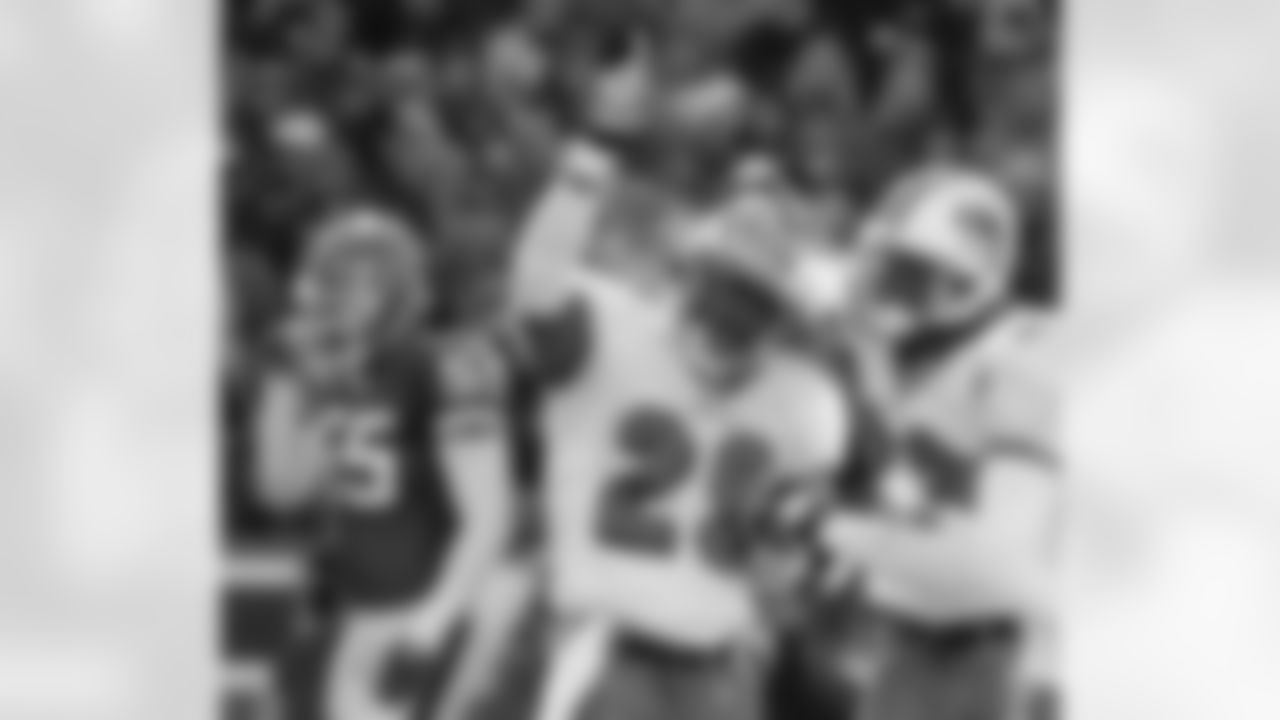 Miami Dolphins cornerback Sam Madison (29) celebrates his interception with teammate Patrick Surtain (23) during the first half of the game against the Buffalo Bills at Ralph Wilson Stadium in Orchard Park, N.Y., Sunday, Dec. 3, 2000. The Dolphins won 33-6. (AP Photo/David Duprey)